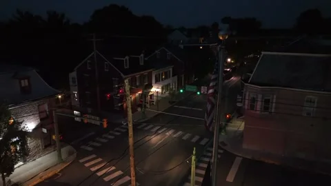 Hanging American flag on flagpole at empty junction of American neighborhood at Stock Footage 315656145