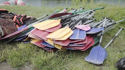 Hanging and life jackets on the river bank Stock Footage 120491237