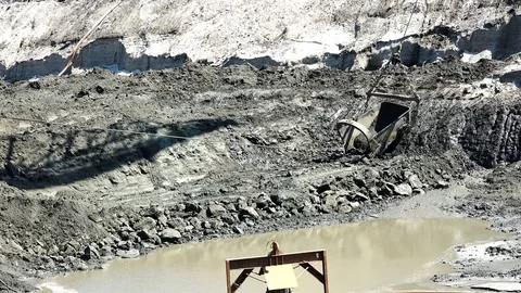 Hanging and pulling ropes pull dragline scoop by scooping raw materials into it Stock Footage 80276992