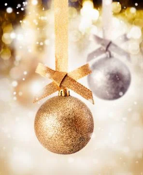 Hanging bauble with falling snow Stock Photos