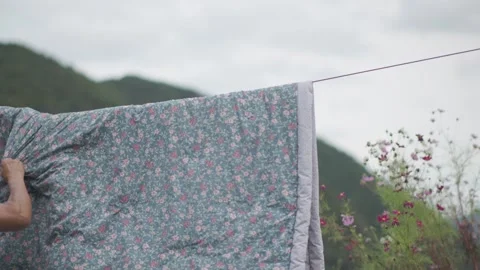 Hanging Bedding to Dry in the Morning Stock Footage 346534035