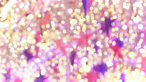 Hanging Blurred Star and Twinkle Colorful Lights Bokeh Background Stock Footage 129296313