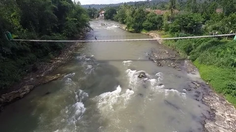 Hanging Bridge above River, Sumatra Stock Footage 75632095