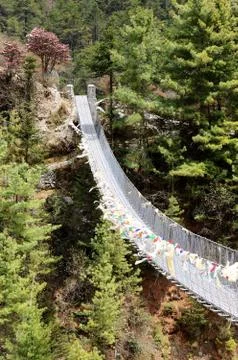 Hanging bridge over the river dudh kosi in eastern nepal,everest region Stock Photos