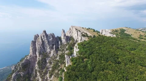 Hanging bridge in steep rocks with going man. Ai-Petri, Crimea Vidéo 65968090