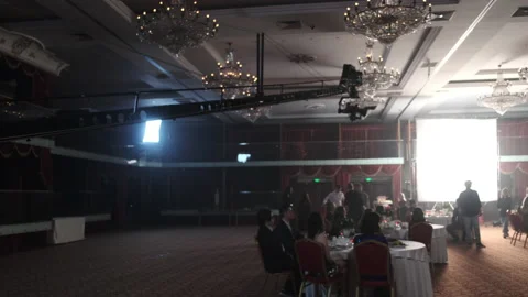 Hanging camera moves shooting extra actors in restaurant Video stock 219806845
