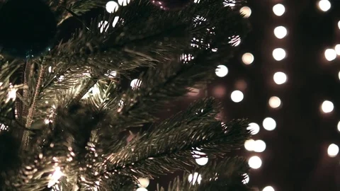 Hanging Christmas Ball On Tree With Lights Stock Footage 70024736