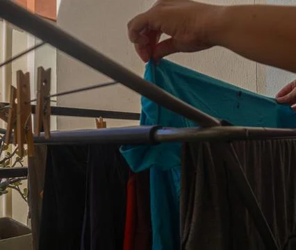 Hanging clothes on the balcony Stock Photos