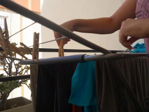 Hanging clothes on the balcony Stock Photos