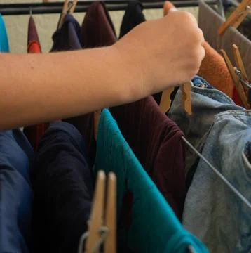 Hanging clothes on the balcony Stock Photos