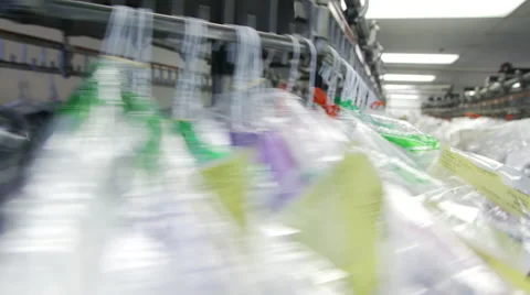 Hanging Clothes Cycle at Dry Cleaner Stock Footage