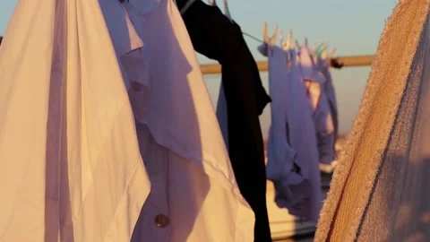Hanging clothes drying in the air on a rooftop Stock Footage 236574864