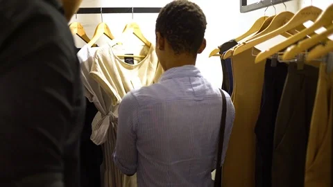 Hanging Clothes in Store Stock Footage 104809156