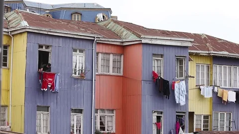 Hanging up clothes from window Stock Footage 77045643