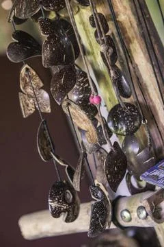  Hanging coconut shell crafts creating a soothing atmosphere in a tropical... 写真素材