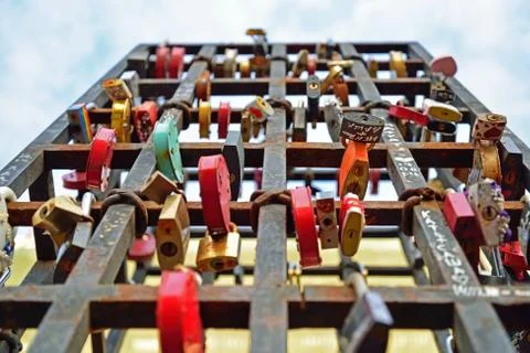 Hanging colored locks on the grid at the background of the sky in Saint-Peter Stock Photos