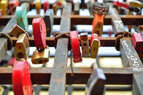 Hanging colored locks on the grid in St. Petersburg Stock Photos