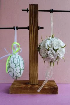 Hanging colorful Easter egg conceptual photo Stock Photos