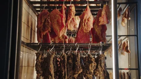 Hanging cured meats in a drying facility Stock Footage 301527355