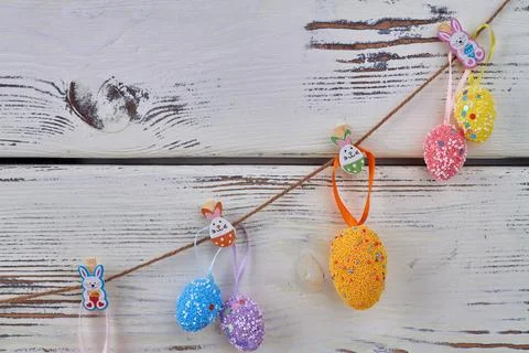 Hanging decorative easter eggs. Easter symbols composition. Stock Photos