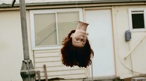 Hanging doll head Stock Footage 63900412