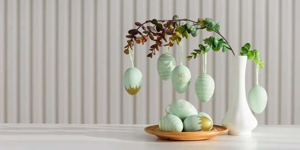 Hanging Easter Eggs and Spring Branches in Vase. Festive Pastel Decor Stock Photos
