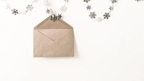 Hanging envelope eco-friendly paper white background with a place for text Stock Photos