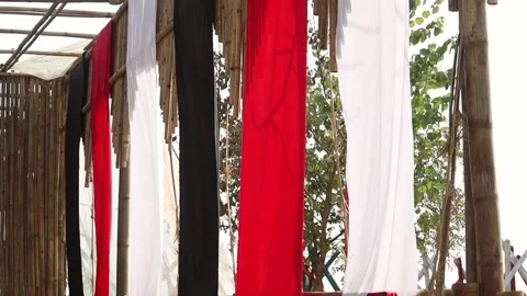 Hanging fabric panels in red, white and black Stock Footage 331277323