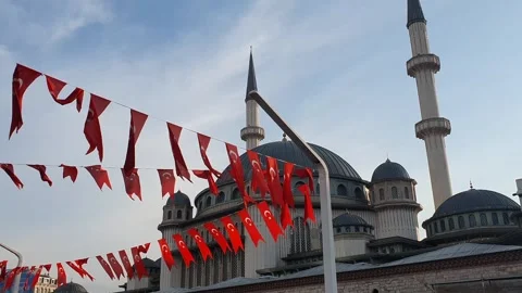 Hanging Flag of Turkey waving infront of Taksim Mosque in Istanbul Stock Footage 240843044