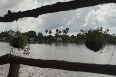 Hanging flower pots river side Stock Photos