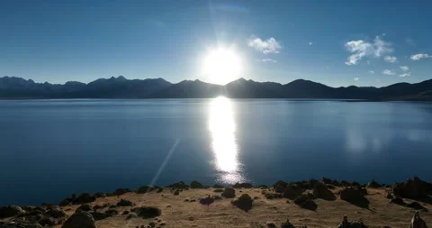 Hanging glacier and snow capped mountain with lake in Tibet, China Stock Footage 304476473