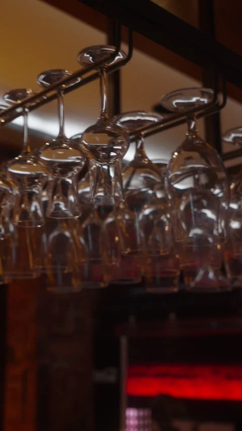 Hanging Glasses in Stylish Bar Interior Stock Footage 335539912