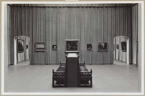 Hanging hall with five paintings at the same level, seen between two passa... Stock Photos