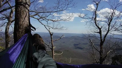 Hanging in hammock on mountainside Stock Footage 58564207