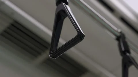 Hanging handle strap inside Tokyo metro subway train carriage Japan Stock Footage 335200300