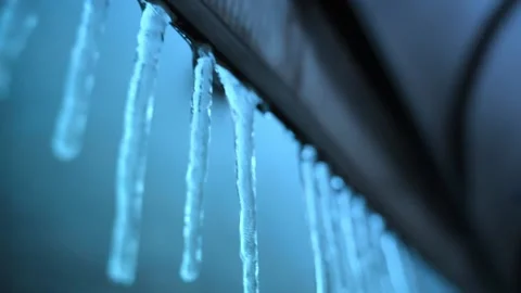 Hanging ice icicles on the canopy close-up. Frozen winter icicles from severe Stock Footage 166883169