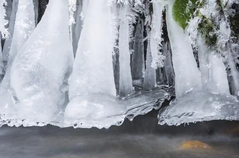 Hanging ice sculptures on a stream in Upper Franconia Stock Photos