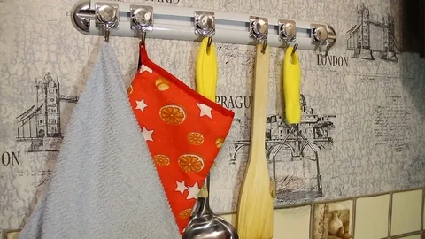 Hanging kitchen scissors on the hook for support rail Stock Footage 82730486