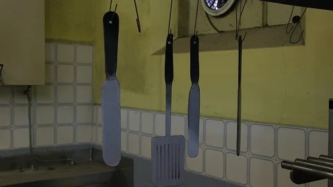 Hanging kitchen spatulas Stock Footage 86784070