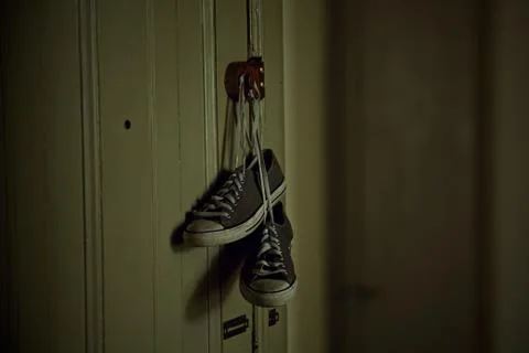 Hanging by the Laces Stock Photos