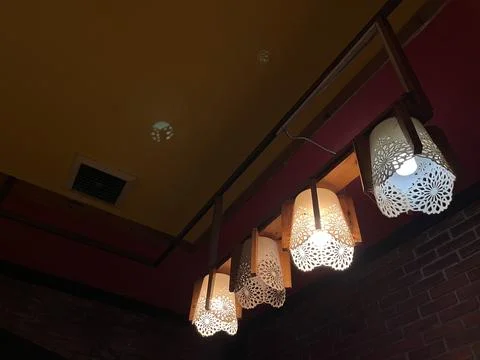 Hanging lamp on the ceiling in the restaurant. Stock Photos