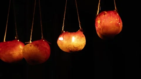 Hanging lanterns with candle light inside, black background Stock Footage 321783412