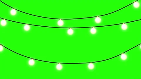 Hanging light bulbs glowing softly on green screen background Stock Footage 320867738