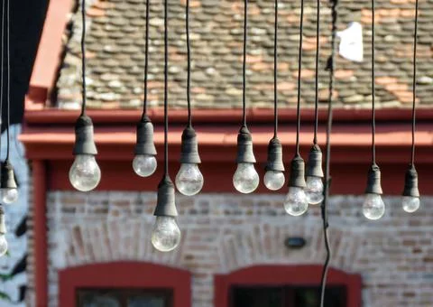 Hanging light bulbs Stock Photos