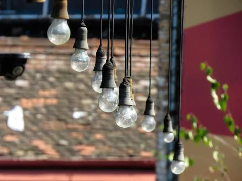 Hanging light bulbs Stock Photos