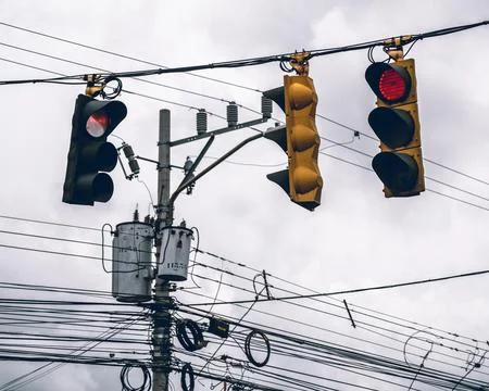 Hanging light traffics in red Stock Photos