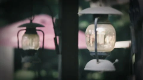 Hanging lighting glass foreground focus light bulb electricity lantern Stock Footage 233684480