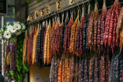Hanging linking of beautiful multi-colored tasty churchkhela Stock Photos