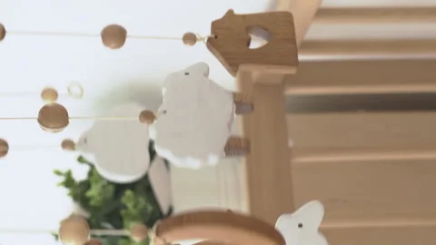 Hanging mobile rotating on the crib Stock Footage 228094305