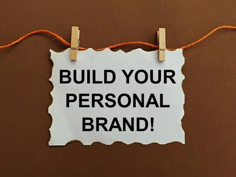 Hanging note written build your personal brand, self-development concept Stock Photos